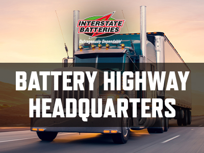 Interstate Battery logo over a truck with the words "Battery Highway Headquarters"