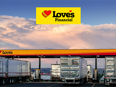 A photo of trucks fueling at the diesel bays with a Love's Financial logo on it