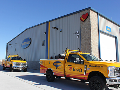 Love's Roadside Assistance trucks parked outside a Speedco in Wichita, KS